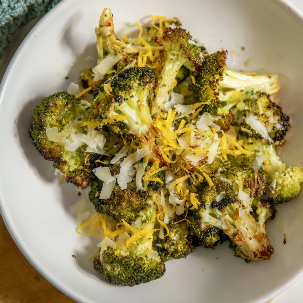 Golden-brown Simple Garlic and Parmesan Roasted Broccoli boasting crispy edges and savory, cheesy goodness.