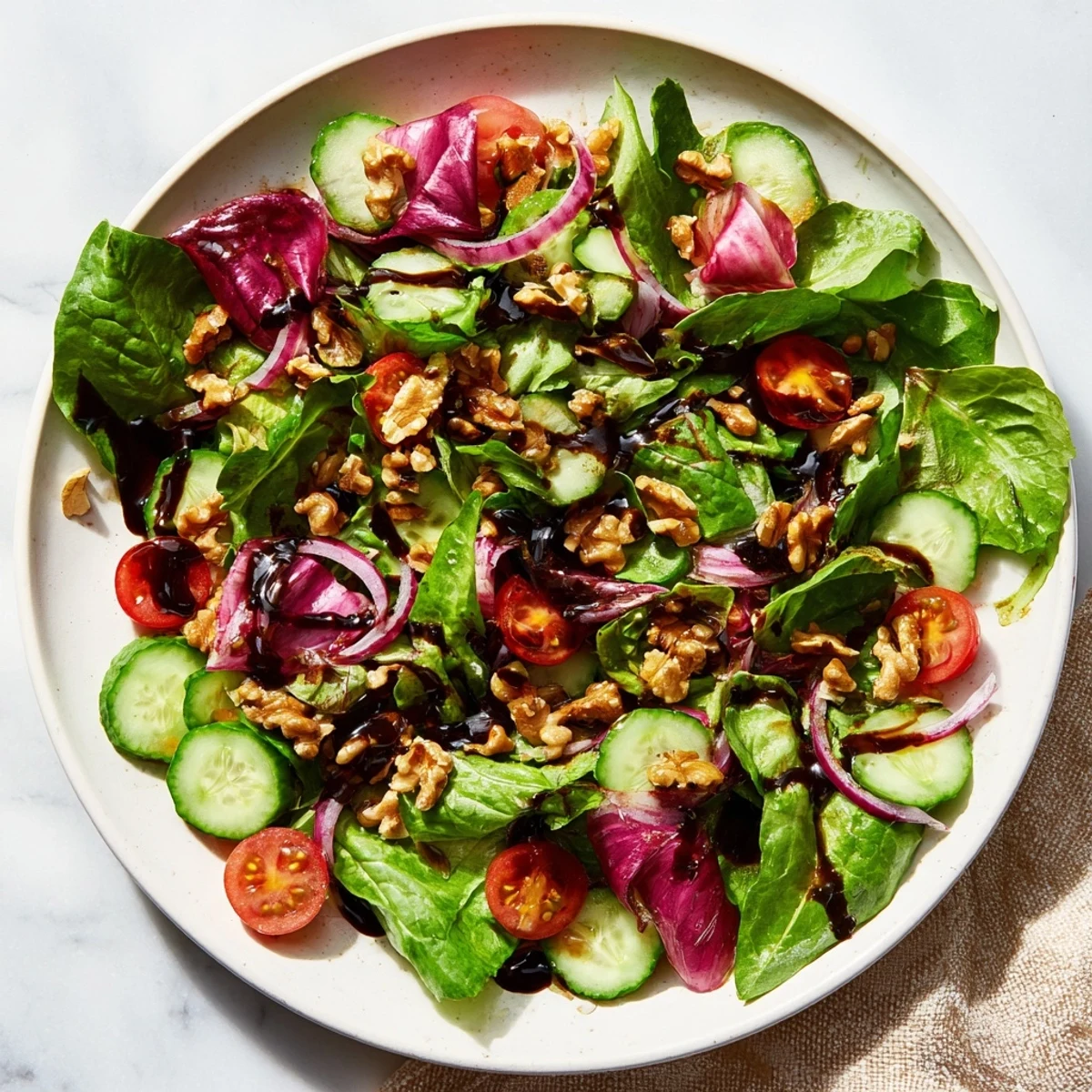 Brightly lit photo of delicious Quick Balsamic Vinegar Salad served, suggesting a light, healthy meal.