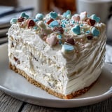 Slice of Candy Hearts Fake Cake served chilled, with silky cream cheese filling and pastel conversation candy decorations.