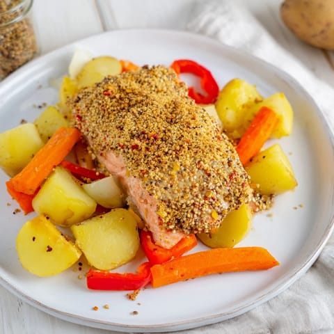 A close-up of a delectable one-tray baked salmon with honey mustard sauce ready to enjoy.