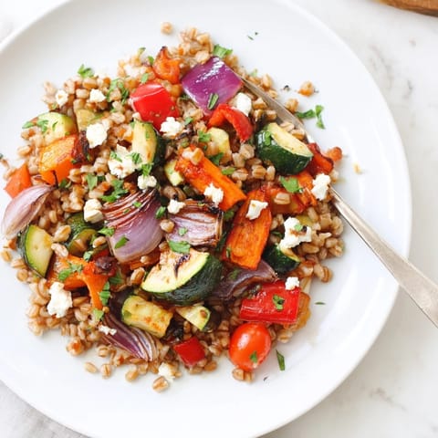 Warm, caramelized roasted vegetables and chewy farro are tossed with fresh parsley and a tangy balsamic drizzle.