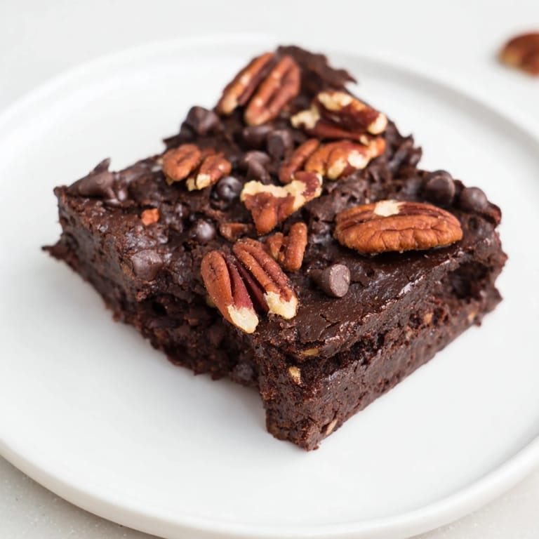 These rich, decadent Black Bean Brownies are best served cold, offering a chocolatey, satisfying treat.