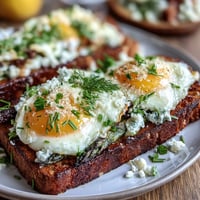 Asparagus and Egg Tartines with creamy scrambled eggs, fresh chives, and tender asparagus on toasted sourdough.